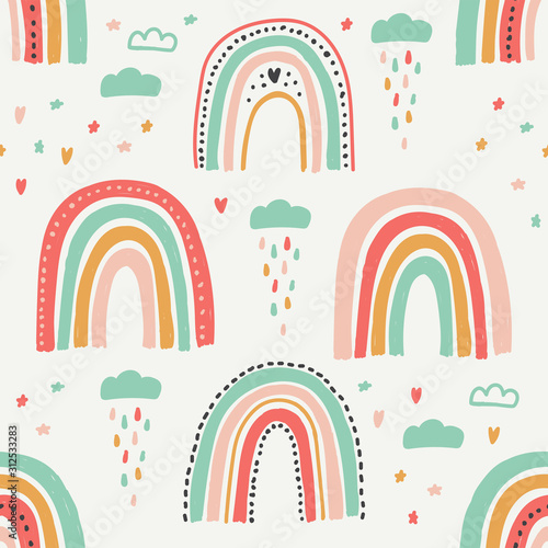Cute scandinavian childish seamless pattern with trendy hand drawn rainbows