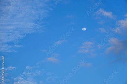 The beautiful, nice and clear blue sky and the moon.