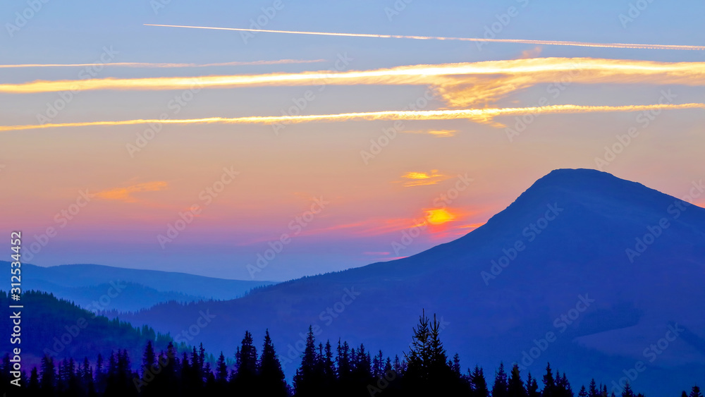 bright sunny dawn on the mountain slopes