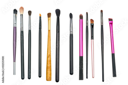 Makeup cosmetics products, set of various make up brushes on a white background