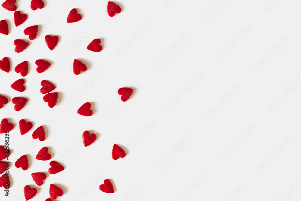  Frame of red confetti in the form of hearts copy space. Decor for baking on Valentine's Day.