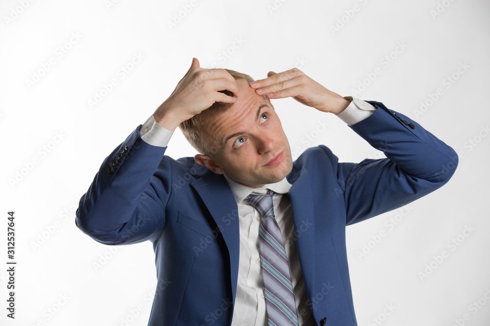 Young attractive businessman fixing his hair Young attractive businessman fixing his hair