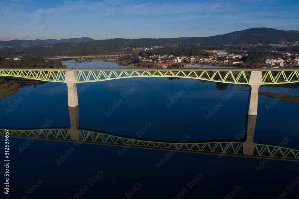 Fototapeta premium railway bridge over the river beautiful landscape shot from a drone