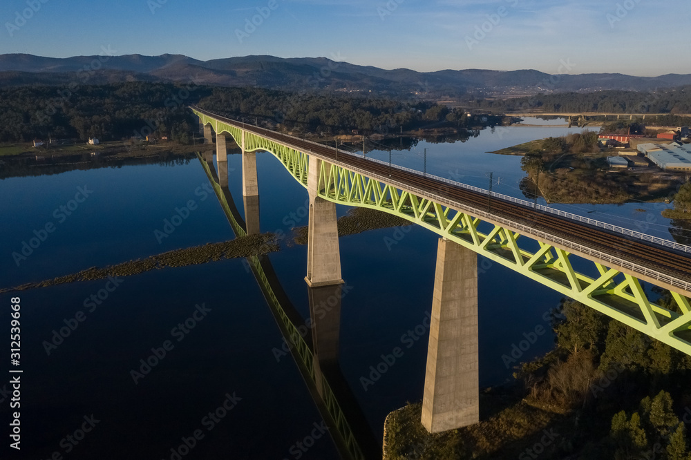 railway bridge over the river beautiful landscape shot from a drone
