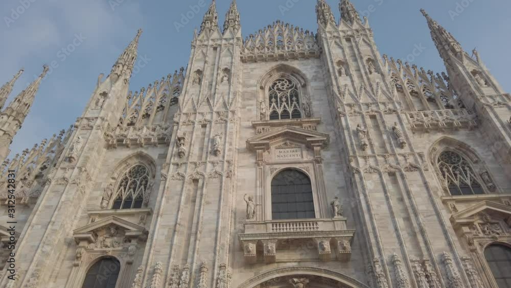 Milano, Italy. The main facade of the Dome, famous Cathedral in Milan. Duomo in Italian. The church is a main landmark of the town Milano, Italy. The main facade of the Dome, famous Cathedral in Milan. Duomo in Italian. The church is a main landmark of the town