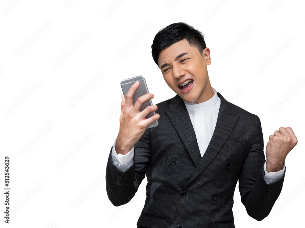 Handsome businessman feel excited while holding mobile phone with a fist in the other hand on white background with clipping path Handsome businessman feel excited while holding mobile phone with a fist in the other hand on white background with clipping path