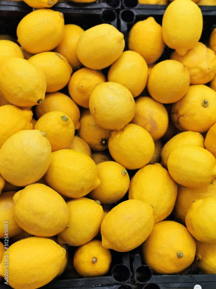 Ripe lemons in a box