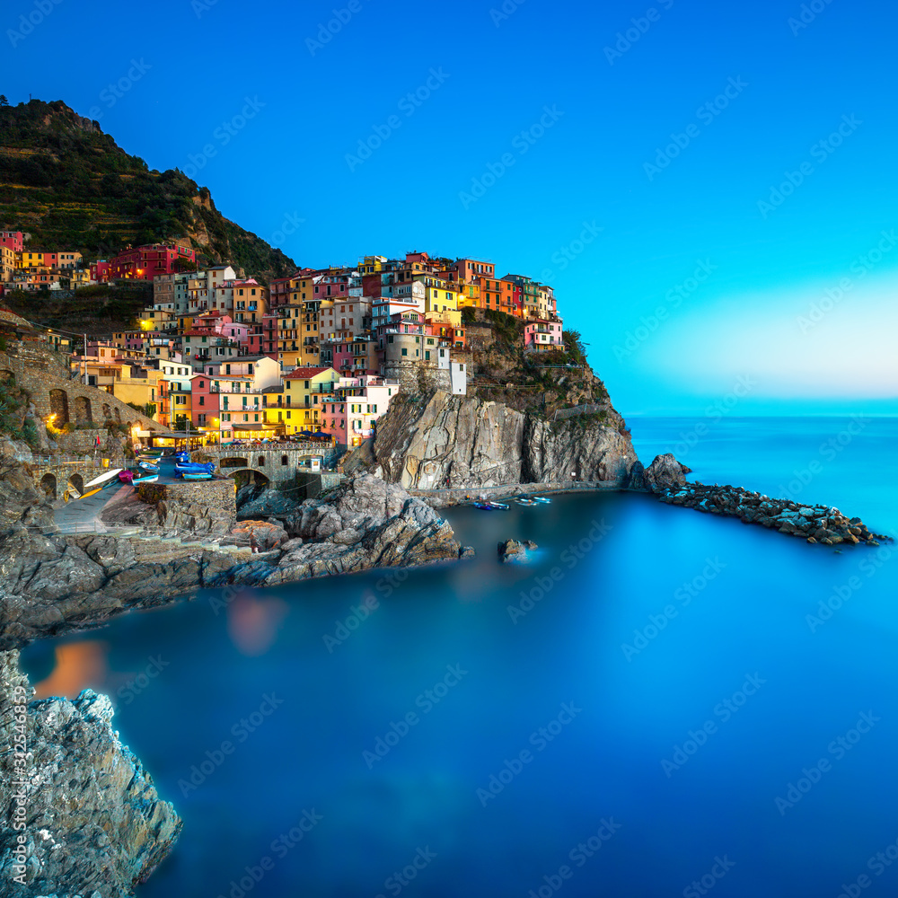 Manarola village, rocks and sea. Cinque Terre, Italy. Long Exposure.