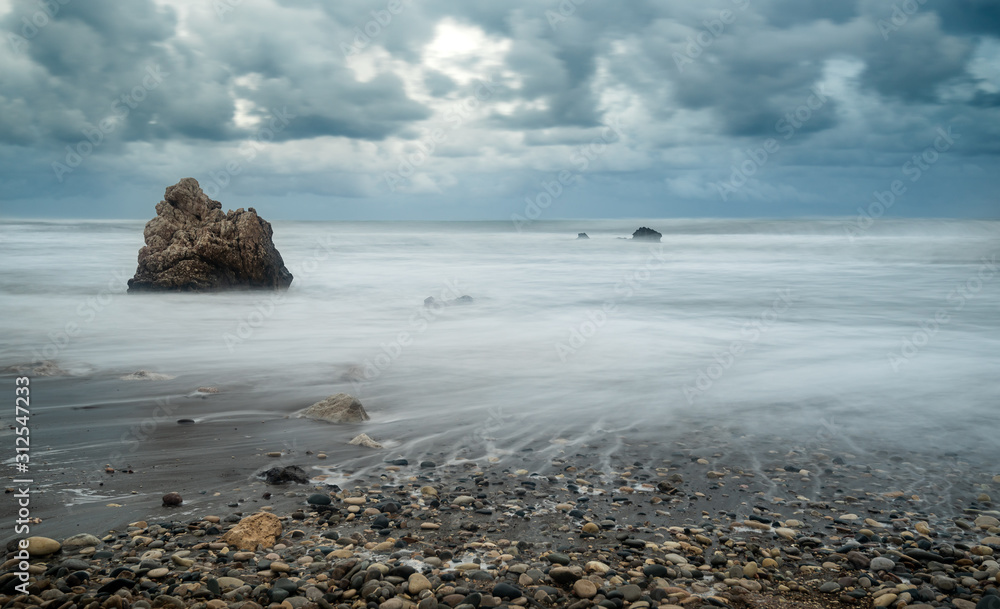 Seascape with windy waves during storm weather a rocky coastline Seascape with windy waves during storm weather a rocky coastline