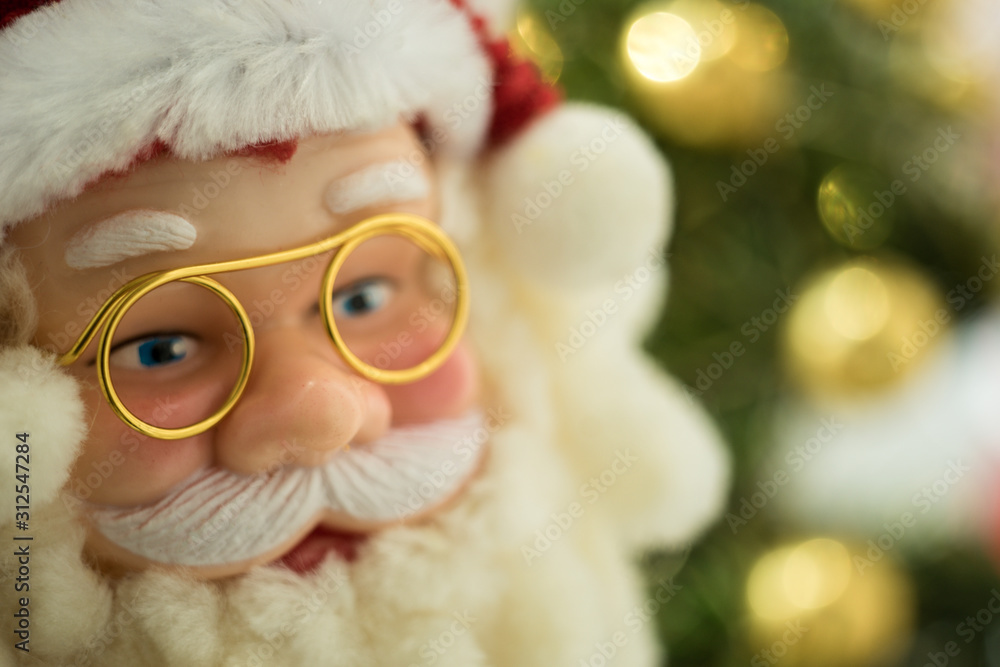 Portrait Santa Claus face in glasses and red hat, close-up toy. Portrait Santa Claus face in glasses and red hat, close-up toy.