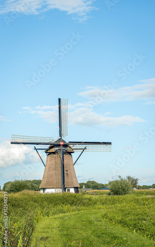 Historical mill in Dutch landscape