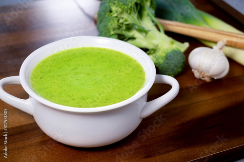Delicious homemade green cream of broccoli soup with leek.