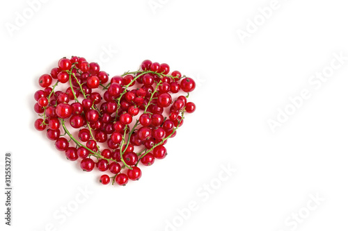 Juicy fresh berries of red currant heart shaped isolated on a white background. Flat lay, Copy space for text. Valentine's day concept