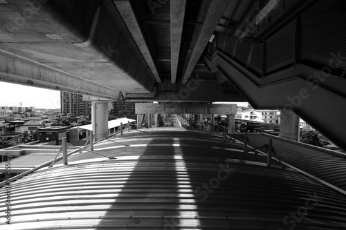 The structure of the roof and the structure of the electric train corridor where sunlight comes in, causing light and shadow.