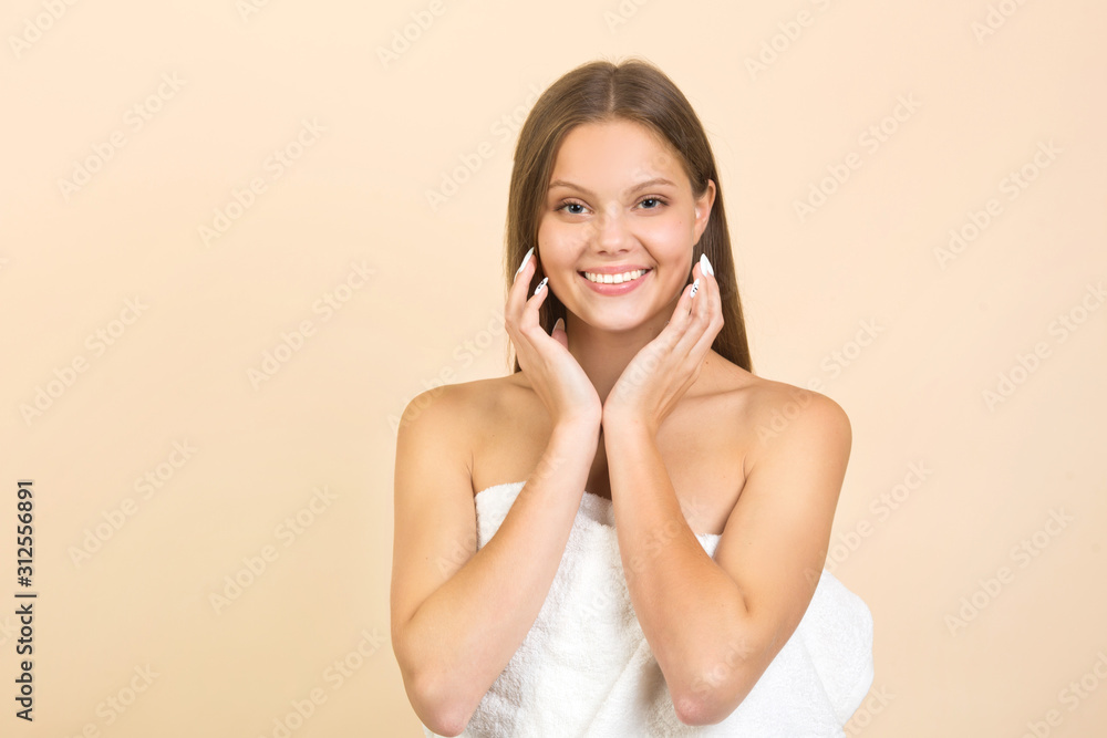 beautiful young woman on a beige background with long flowing hair beautiful young woman on a beige background with long flowing hair