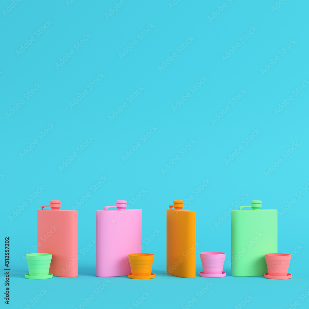 Four hip colorful flasks with cup on bright blue background in pastel colors. Minimalism concept Four hip colorful flasks with cup on bright blue background in pastel colors. Minimalism concept