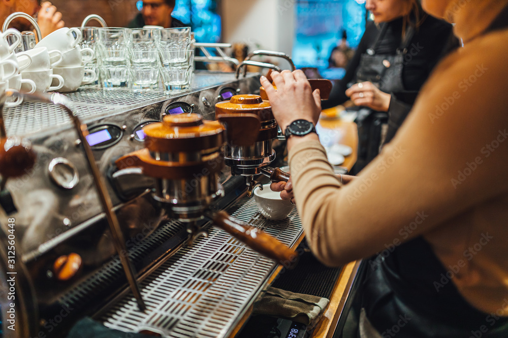 Barista making coffee from espresso machine in coffee shop Barista making coffee from espresso machine in coffee shop
