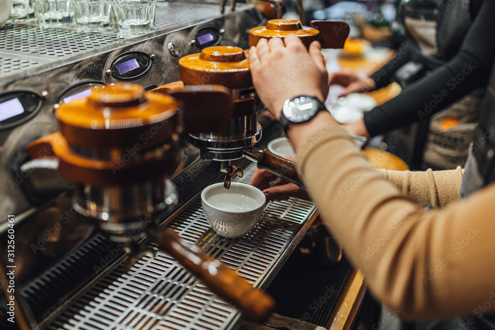 Barista making coffee from espresso machine in coffee shop Barista making coffee from espresso machine in coffee shop