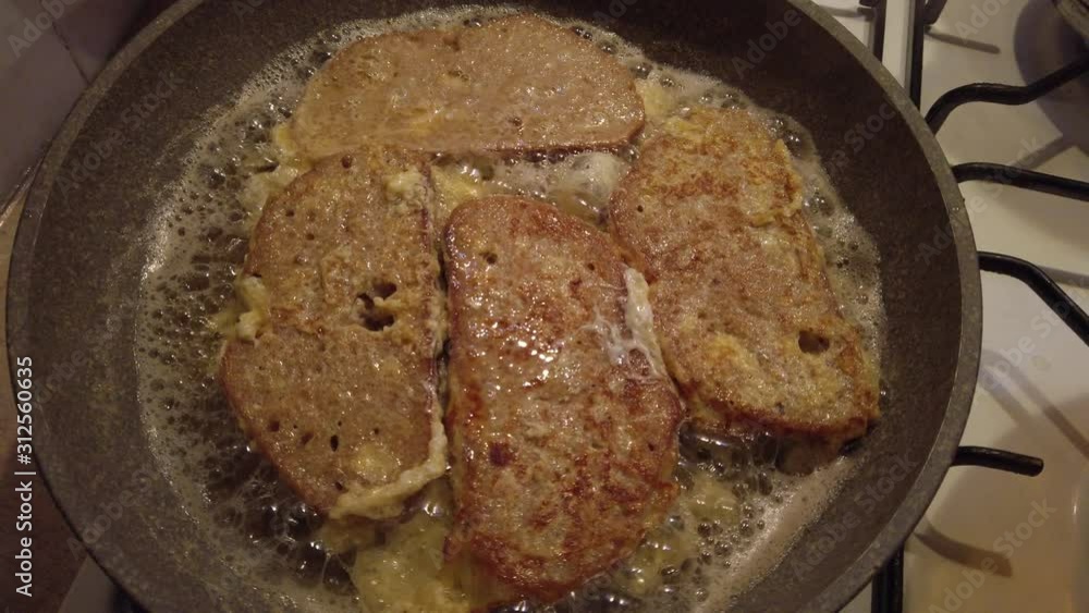 Traditional meal known as french toast is fried bread slices covered with egg and milk. Traditional meal known as french toast is fried bread slices covered with egg and milk.