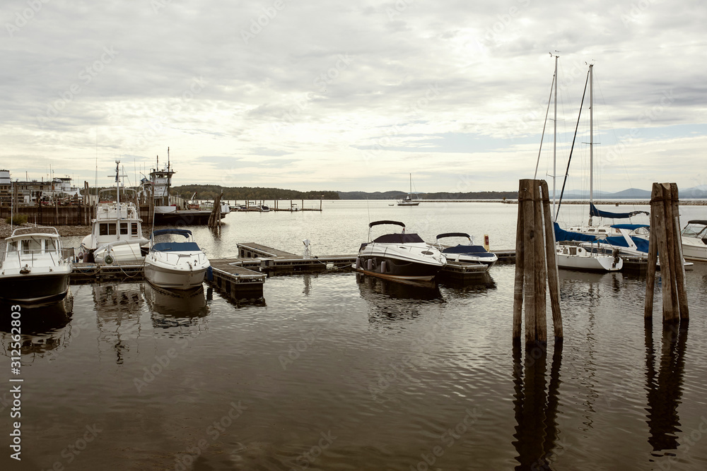 Boats docked along a harbor at Lake Champlain in Burlington, Vermont