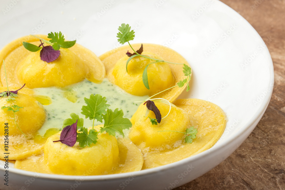 Ravioli on a plate, restaurant serving, close up.