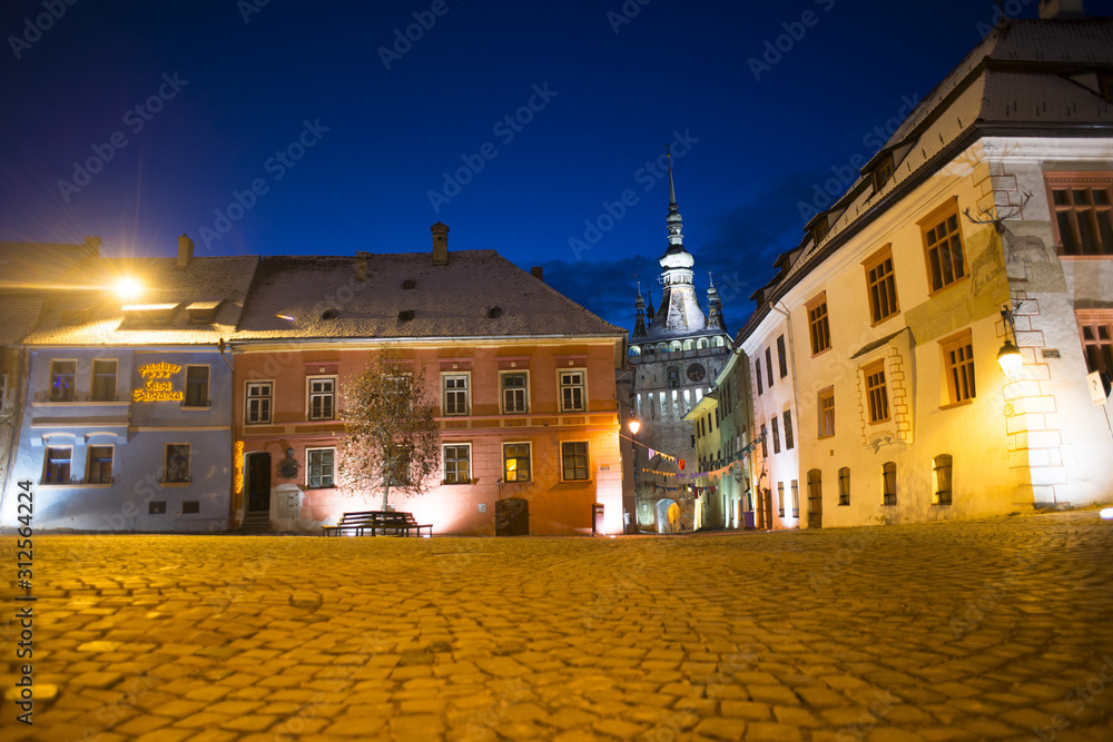 Sighisoara Transylvania town night time scene of Clock Tower and main Square