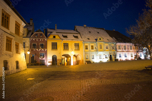Sighisoara Transylvania town night time scene of Clock Tower and main Square