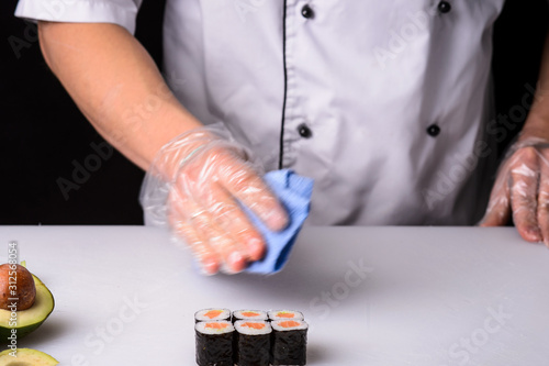 Chef cooks maki in stages