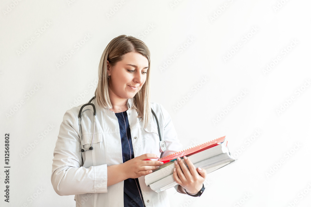 Medical conceptual, hospital or clinic medical service. young intern nurse holding a clipboard Medical conceptual, hospital or clinic medical service. young intern nurse holding a clipboard