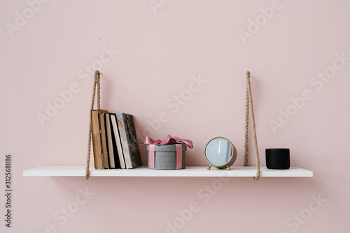 Stylish things on hanging shelf photo