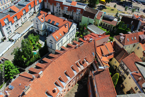 Red brick roofs of houses with a drone
