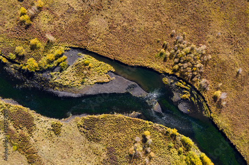 Aerial view of the river on prairie in autumn photo