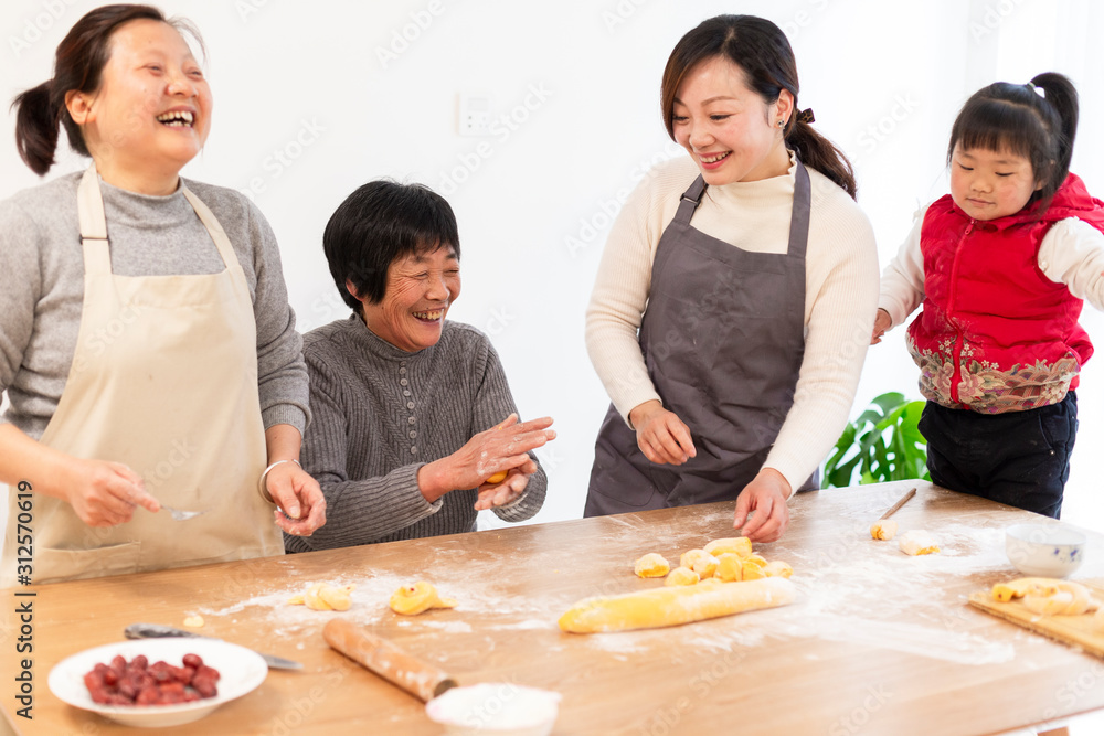 happy asian family making Chinese bread in home happy asian family making Chinese bread in home