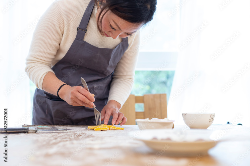 happy asian family making Chinese bread in home happy asian family making Chinese bread in home