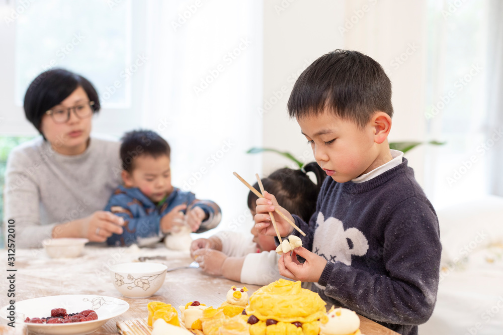 happy asian family making Chinese bread in home happy asian family making Chinese bread in home