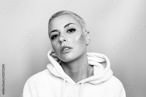 Young woman with band aid