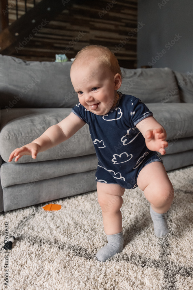 Baby taking first steps Baby taking first steps