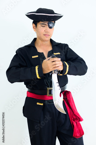 Young adult South East Asian wearing pirate costume with white background..