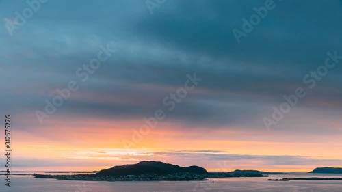 Alesund, Norway. Amazing Natural Bright Dramatic Sky In Warm Colours Above Alesund Valderoya And Islands In Sunset Time. Colorful Sky Background. Beauty In Norwegian Nature. 4K photo