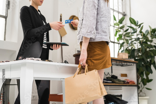 Payment moment at cash desk in a shop