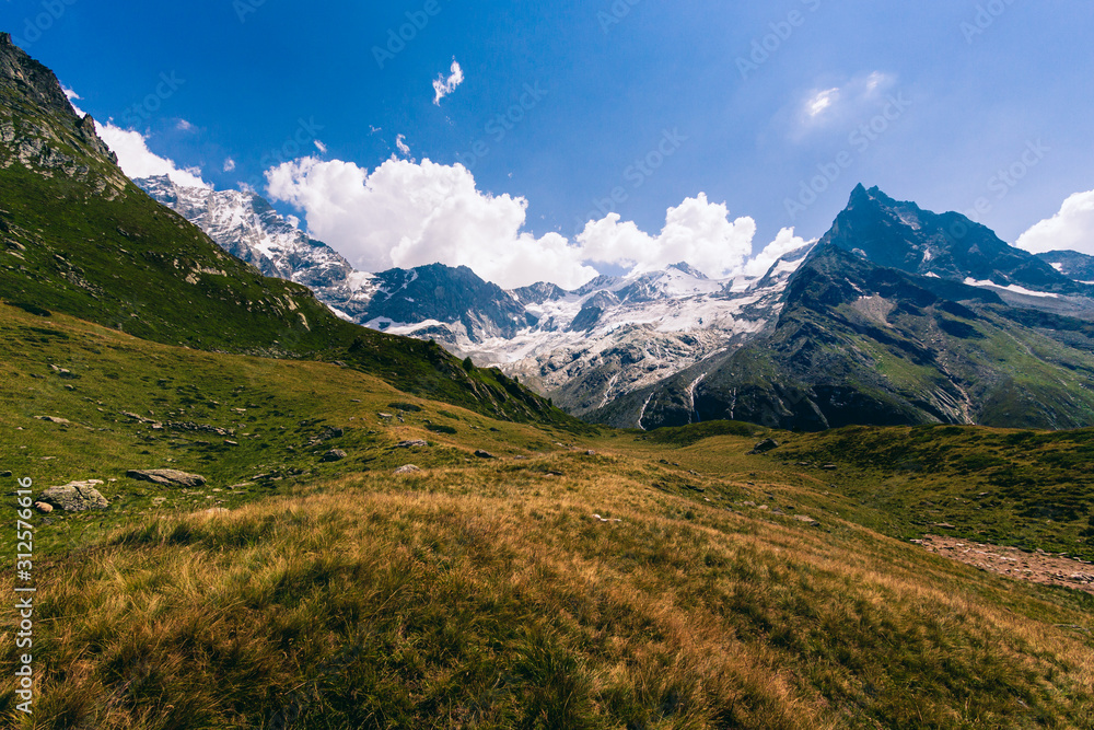 Peaks of the Besso, Zinalrothorn and Weisshorn and the Moming Glacier in the Swiss canton Valais (Wallis) in the Pennine Alps near the lake Arpitetta