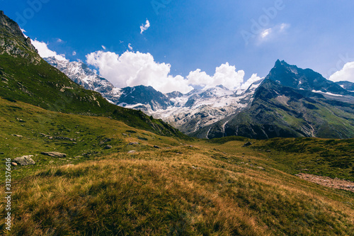 Peaks of the Besso, Zinalrothorn and Weisshorn and the Moming Glacier in the Swiss canton Valais (Wallis) in the Pennine Alps near the lake Arpitetta