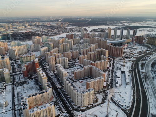 Pavshinskaya poyma district of Krasnogorsk, Moscow region, Russia. Mitino District is administrative district  of Moscow. Commuter town with very dense houses. View above.  Winter snow day photo