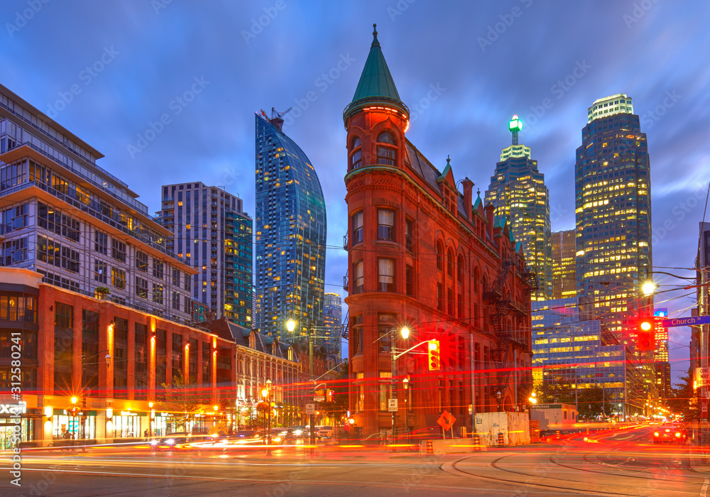 Gooderham Building, also known as the Flatiron Building, during the blue hour with light trails, Toronto, Canada