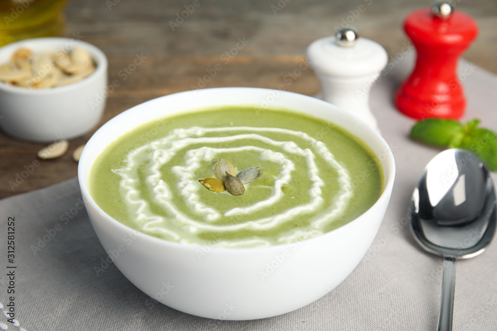 Delicious broccoli cream soup served on table Delicious broccoli cream soup served on table
