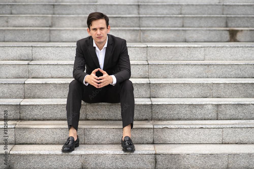 Businessman sit at office staircase. Businessman sit at office staircase.