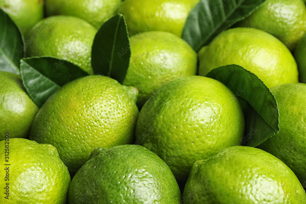 Fresh ripe juicy limes as background, closeup Fresh ripe juicy limes as background, closeup