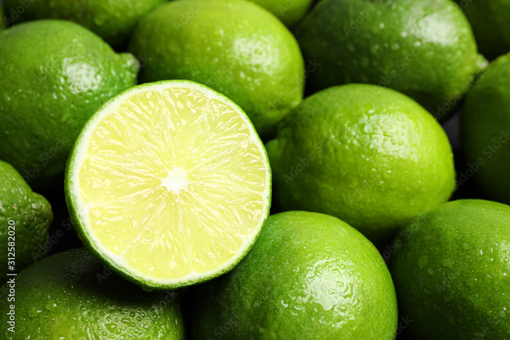 Fresh ripe juicy limes as background, closeup Fresh ripe juicy limes as background, closeup