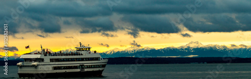 Seattle Downtown Waterfront Sunset with Olympic Mountains, Boat, Puget sound, Elliott Bay, Dramatic puffy white clouds