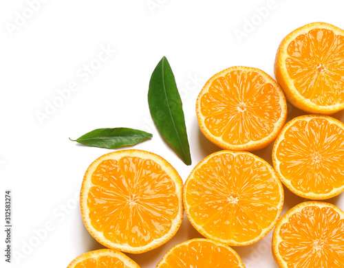 Composition with halves of fresh ripe tangerines and leaves on white background, top view. Citrus fruit
